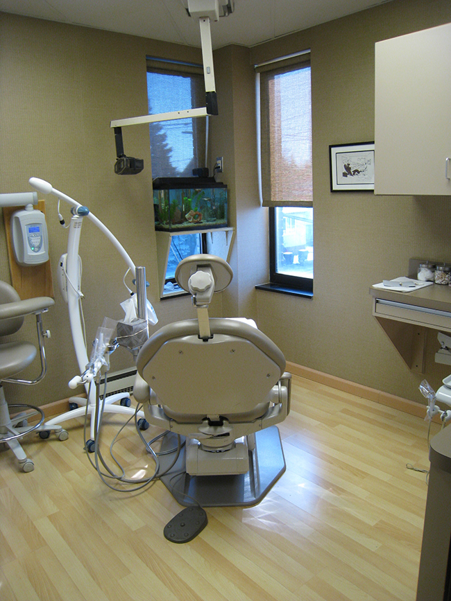 Dental office with modern equipment and a well-lit interior.